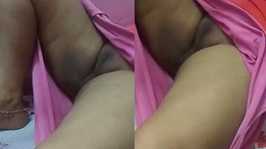 Relaxed Desi aunty lies on the bed with her sweet XXX vagina exposed